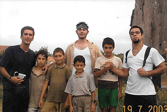 Hovig Apo Saghdejian and fellow Land and Culture Organization (LCO) volunteers with the children of Ayroum where they were working during the summer of 2003.