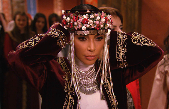 American reality TV star Kim Kardashian seen in traditional Armenian garb in a promotional clip for season 10 of "Keeping Up With The Kardashians" (Source: E!)