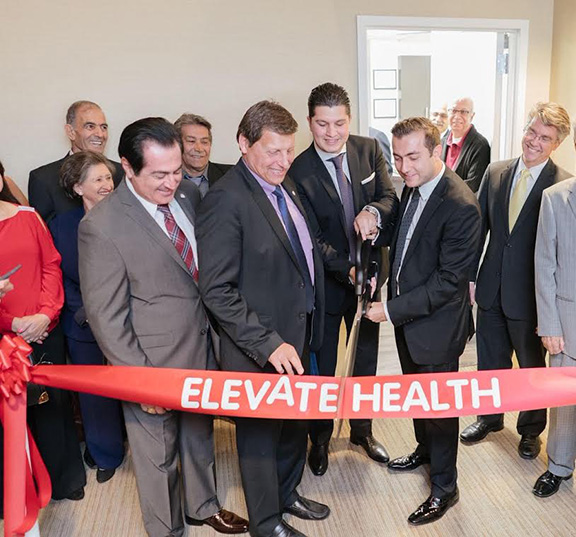 Glendale City Councilman Vartan Gharpetian, Glendale Mayor Ara Najarian and principals of Elevate Group cut the ribbon to the new facility
