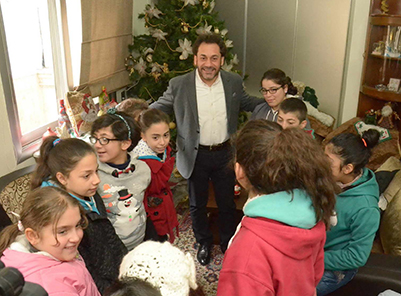 Rev. Haroutune Selimian with the Children of the Armenian Orphanage in Aleppo. (Source: Studio Venus)