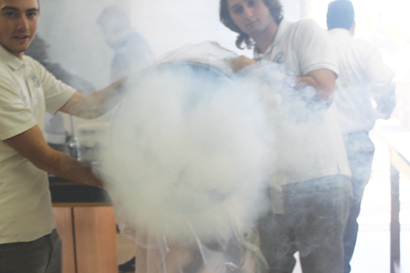 21.Mesrobian High School students build  "Smoke Vortex Ring Cannons" to show the relation between Fluid Dynamics, waves and Periodic Motion.