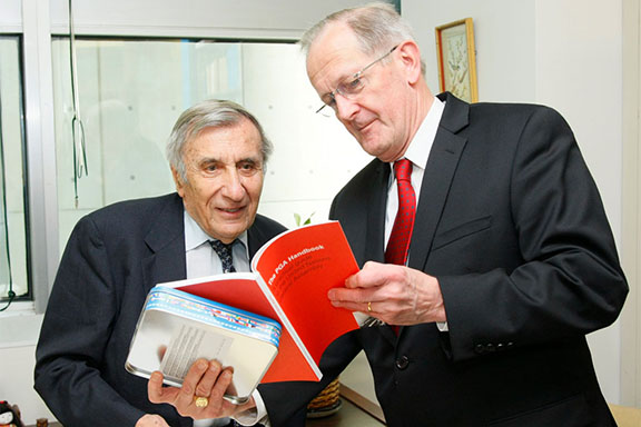 Joseph Deiss (right), President of the sixty-fifth session of the General Assembly, exchanges views with Jean Gazarian, who worked with UNITAR since 1987, teaching diplomats and staff. (Source: UN Photo/JC McIlwaine)