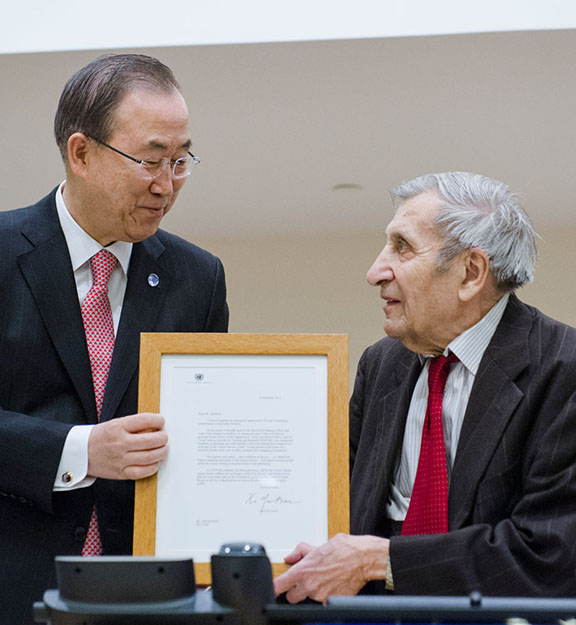 Secretary-General Ban (left) at an event marking UNITAR's 50th anniversary and honouring its Senior Fellow, Jean Gazarian (right), who began his UN career in 1946. (Source: UN Photo/Amanda Voisard)