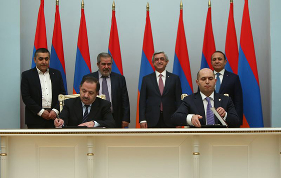 ARF's Aghvan Vartanian and the Republican Party's Armen Ashotian sign deal as President Serzh Sarkisian and ARF leaders look on