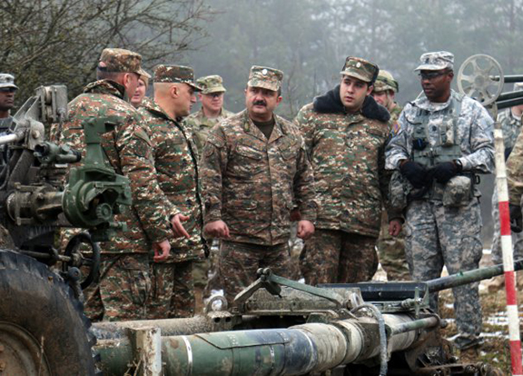 Armenian Maj. Gen. Gennady Tavaratsyan, chief of the strategic planning department of the armed forces, visits with American troops during Exercise Allied Spirit IV at the U.S. Army's Joint Multinational Training Command in Hohenfels Training Area. (Source: Army.mil.)
