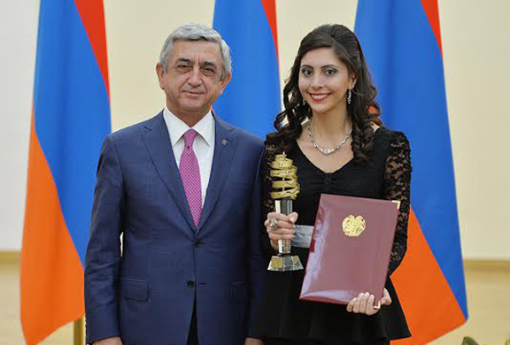 Gasia Atashian, who escaped the war in Syria in 2013, excels academically as a sophomore in AUA's Department of Computational Sciences. She is shown here posing with President of the Republic of Armenia Serzh Sargsyan who awarded her with a highly competitive prize for her educational accomplishments in IT.