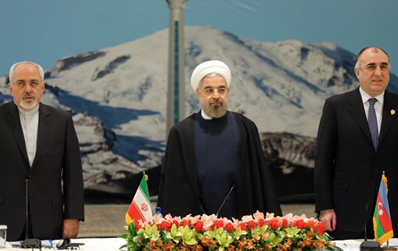 Iranian Foreign Minister Mohammad Javad Zarif, President Hassan Rouhani and Azerbaijan's Foreign Minister Elmar Mammadyarov attend the opening session of a two-day conference of the Economic Cooperation Organization. (Source: ATTA KENARE/AFP/Getty Images)