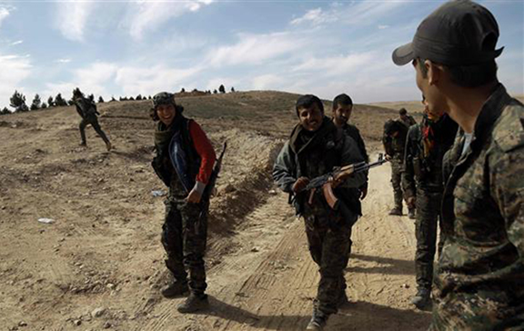 Fighters from the Syrian Democratic Forces (SDF) gather on the outskirts of the town of Shaddadah in the northeastern Syrian province of Hasakah, on February 19, 2016. (Source: AFP)