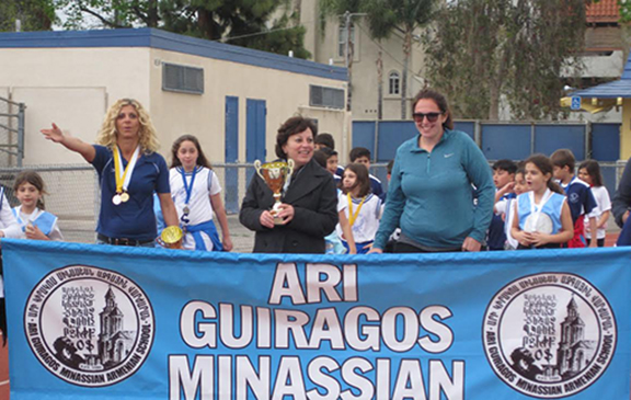 Ari Guiragos Minassian faculty and students marching.