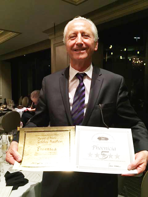 Phoenicia Restaurant owner Ara Kalfayan displays his award certiicate 