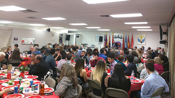 Vahe Bozoyan of the A.R.F Western Region Central Committee speaking to a full community center