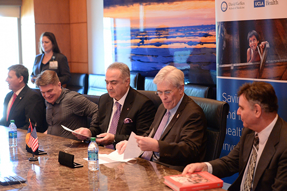 Dr. Sevak Avagyan and Dr. Thomas Coates signing the memorandum of understanding.