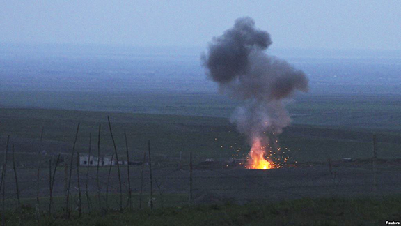 Smoke from fire rises above the ground in Martakert district, after an Azerbaijani unmanned military air vehicle was shot down by the self-defense army of Nagorno-Karabakh (Reuters Photo)