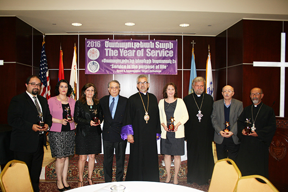 Honorees flank the Prleate