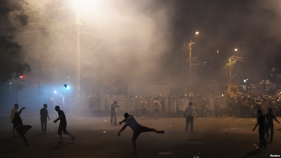 Demonstrator on Khrentasi Street clash with riot police on Wednesday (Reuters photo)