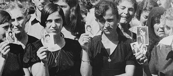 Cypriots hold up photos of missing family members following Turkey’s 1974 invasion. Over 5,000 Cypriots were killed while hundreds of thousands of refugees were ethnically cleansed and forced into concentration camps. Excavations and DNA testing continue to this day to locate the thousands that are missing and to bring closure to their families.
