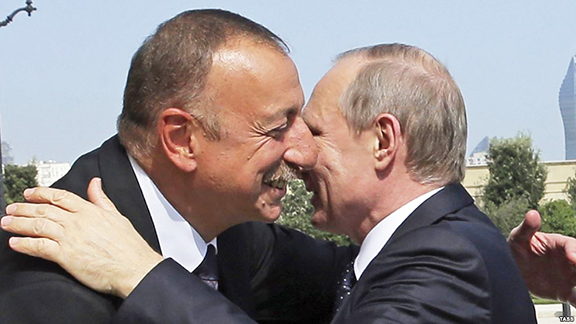 Azerbaijani President Ilham Aliyev and his Russian counterpart Vladimir Putin embrace in Baku on Monday (TASS photo)