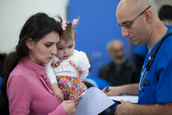 Doctor assisting patient in Noyemberyan, Armenia