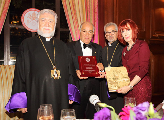 Catholicos Aram I presents a gift to Mr. and Mrs. Harry and Cheryl Nadjarian, the evening's hosts