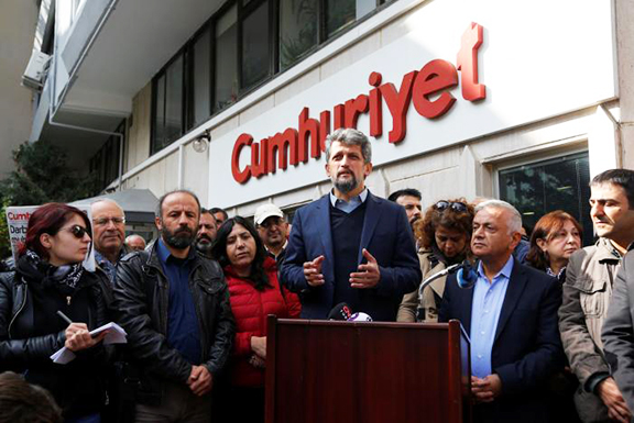 Garo Paylan, an Armenian lawmaker of the Pro-Kurdish Peoples' Democratic Party (HDP), talks to media during his visit at the headquarters of Cumhuriyet newspaper, an opposition secularist daily, in Istanbul on Oct. 31, 2016. (Photo: Reuters/Murad Sezer)