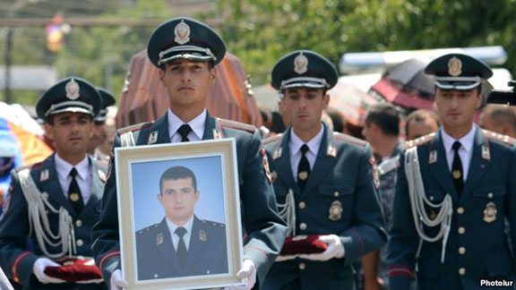 Funeral of police officer Yuri Tepanosian, who was killed during a standoff between policemen and opposition gunmen (Photo: Photolur)