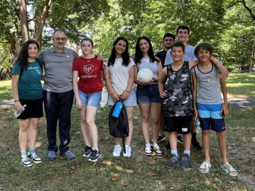 ANCA interns with St. Mary Armenian Church pastor Fr. Hovsep Karapetyan and members of the ACYOA enjoying a game of volleyball following Vardavar celebrations.